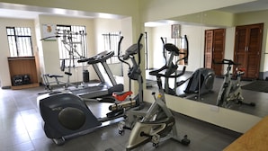 A gym with various exercise equipment, including treadmills, elliptical machines, and weight machines. - Lighthomez Angles Heights (Nairobi)