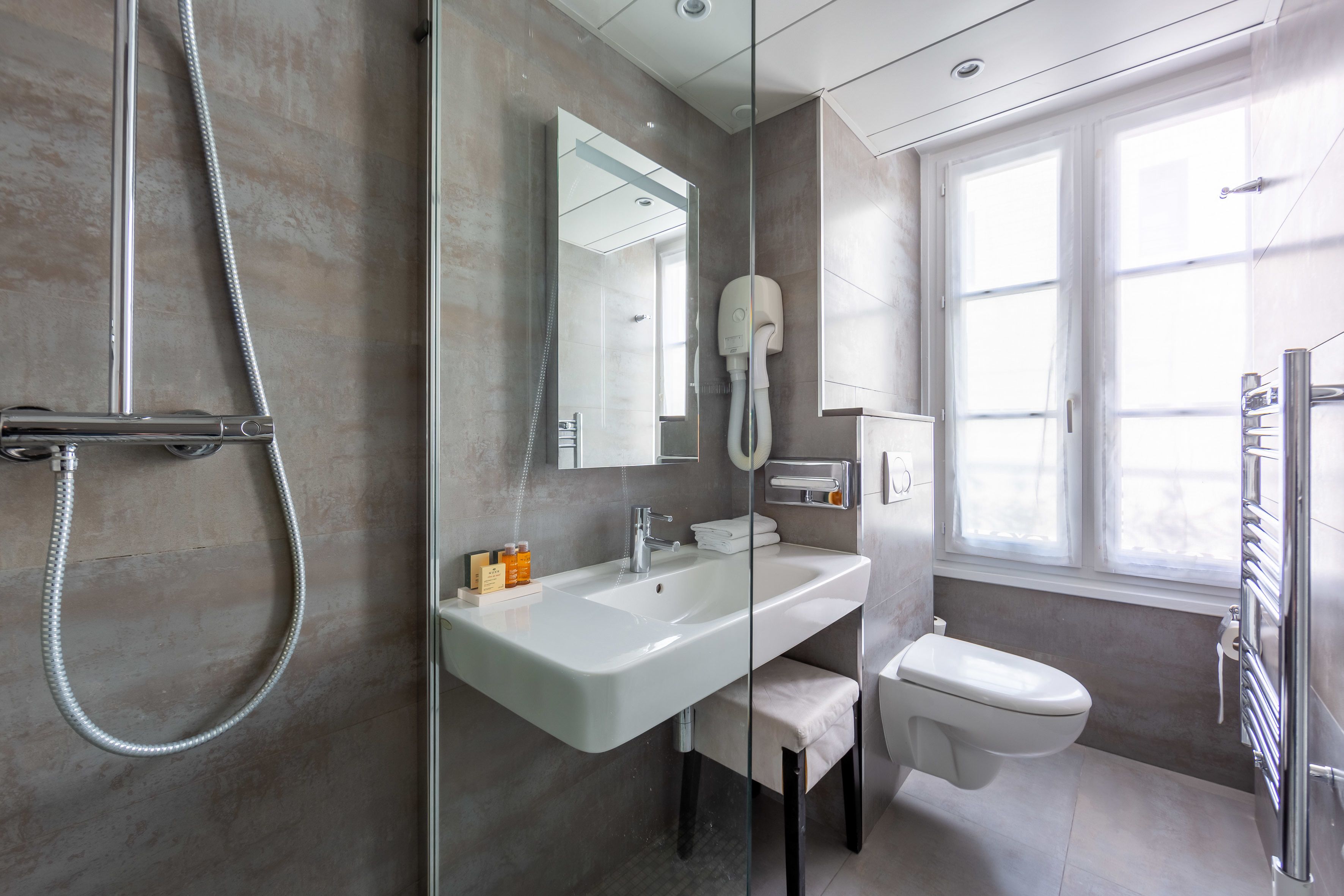 superior twin room | bathroom | hair dryer, towels