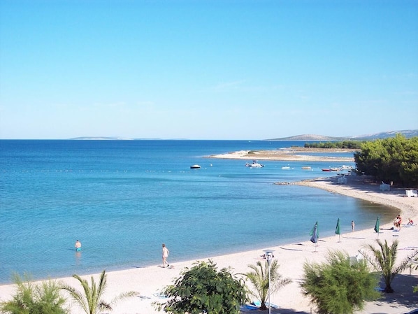 On the beach, sun-loungers