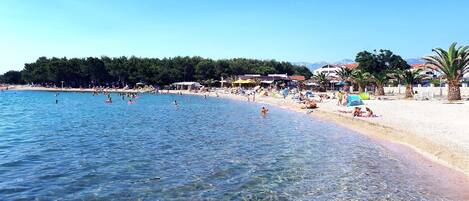 On the beach, sun loungers