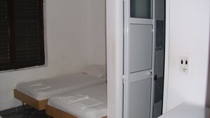 A small, clean room with two single beds, a white wardrobe, and a window with blinds. - Economy double room - close to the Velika Plaza for cheap price (UL)