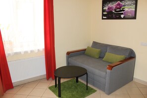 Apartment (1) | Living area | Flat-screen TV - Apartments Knyazhy Lviv (Lviv)