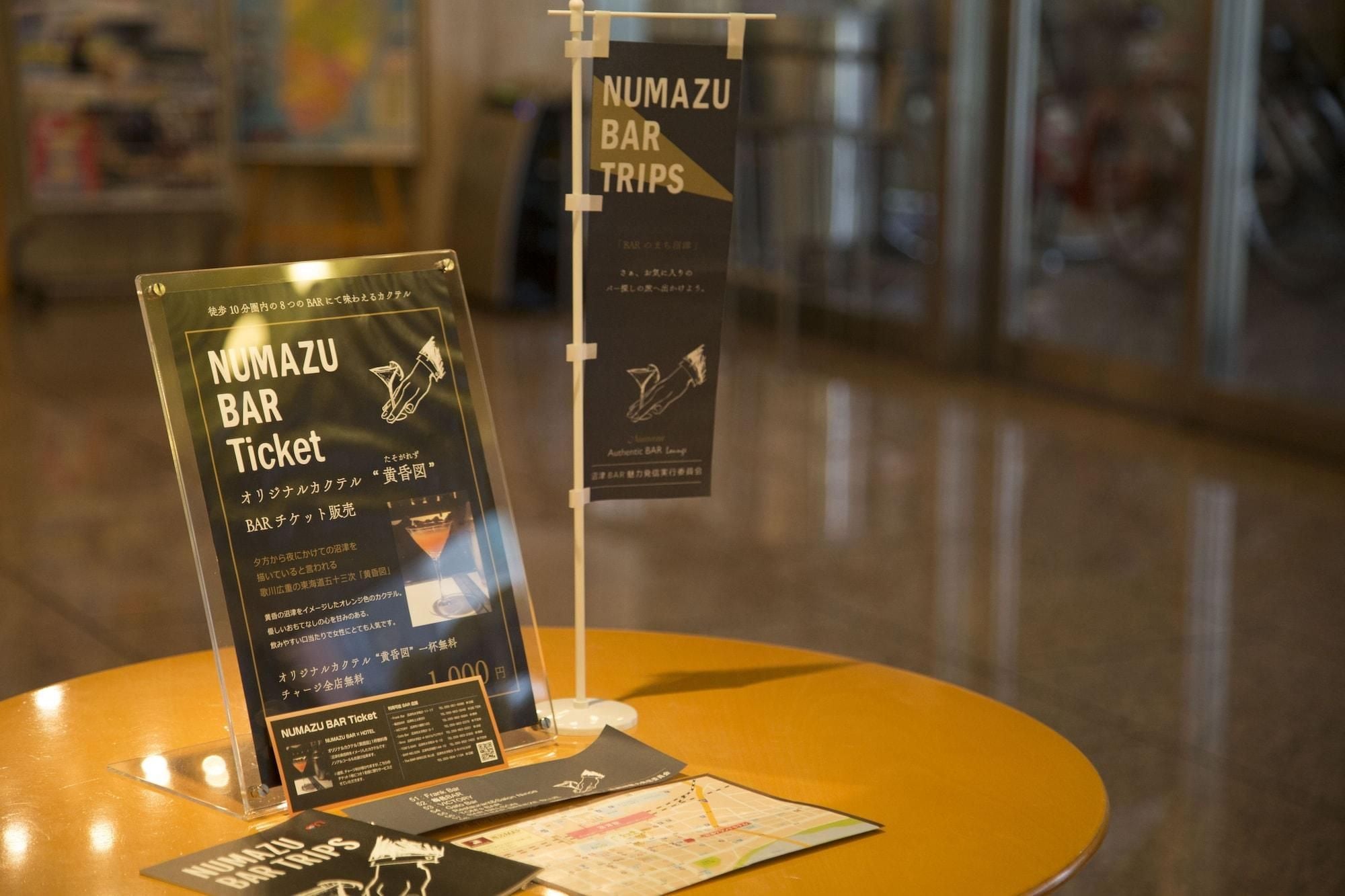 A bar ticket display with a map and a QR code.