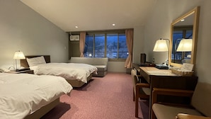 A hotel room with two beds, a desk, a chair, a large mirror, and a window with curtains. - Kamiyama Onsen Hotel Shikinosato & Iyashinoyu (Kamiyama)