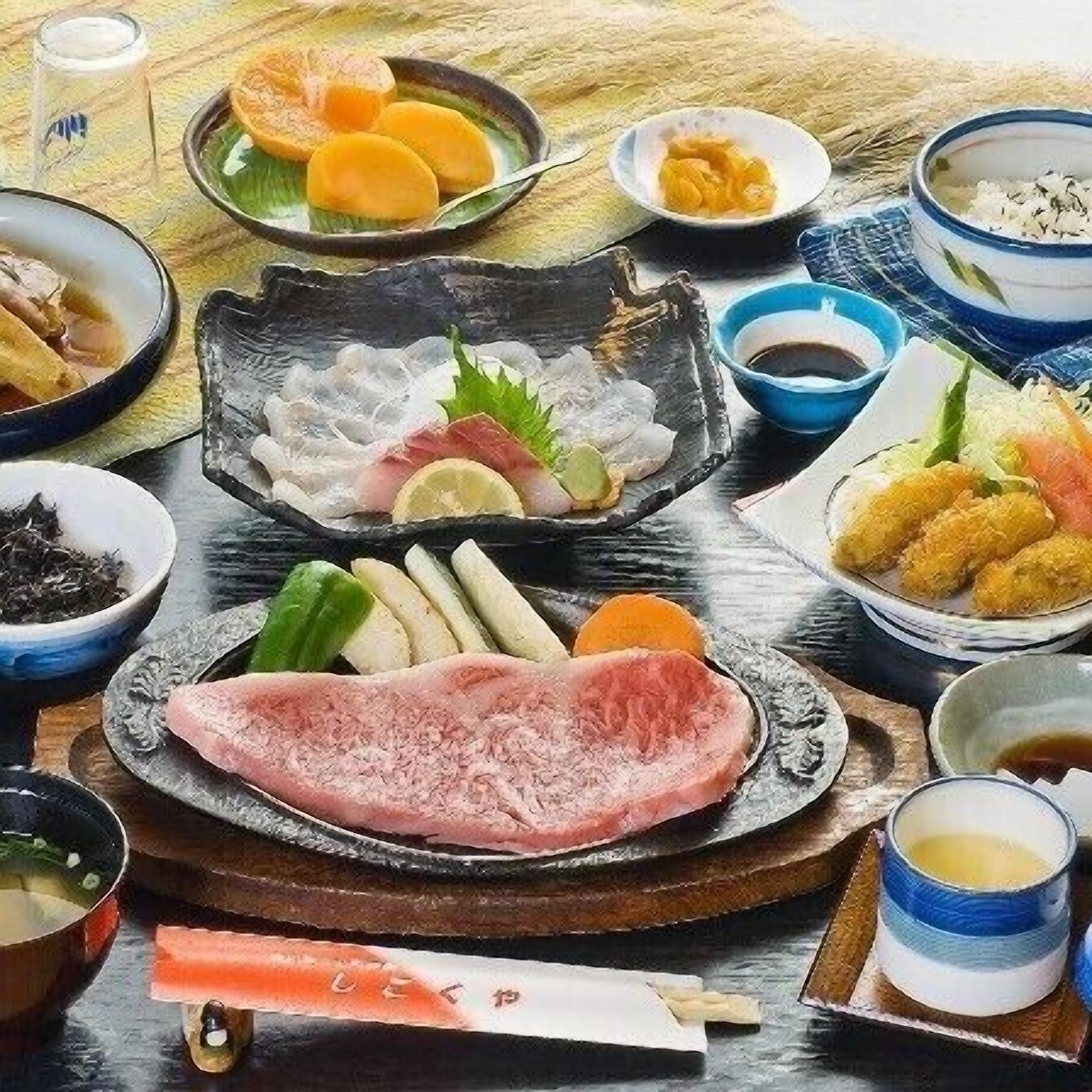 A variety of Japanese dishes on a wooden table.