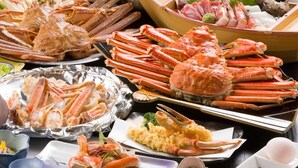 A variety of seafood dishes, including crab legs and shrimp, arranged on a table. - New Marutaso (Kyotango)