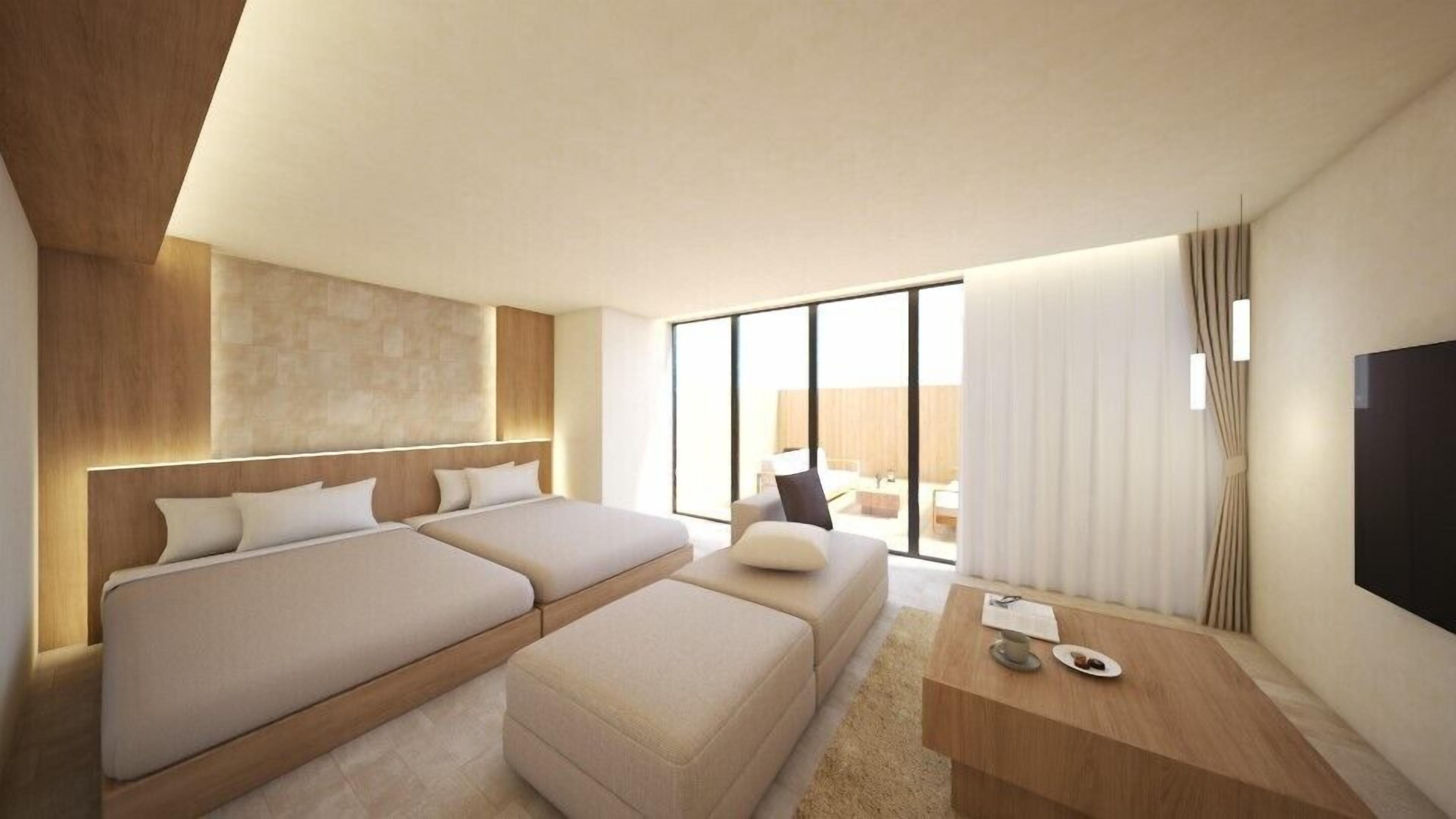 A modern hotel room with two beds, a sofa, a TV, and a large window.