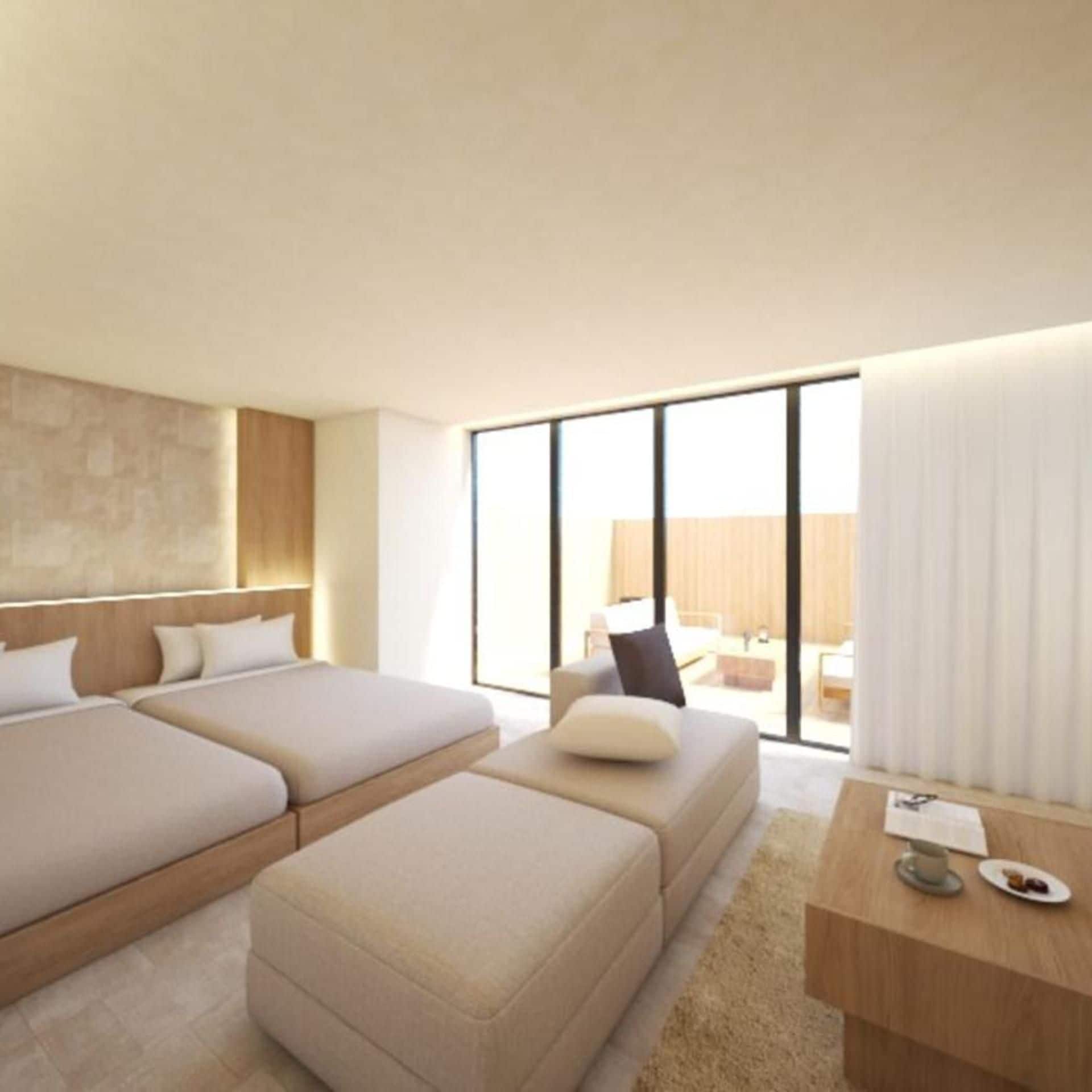 A modern hotel room with a large bed, a sofa, a desk, and a view through a large window.