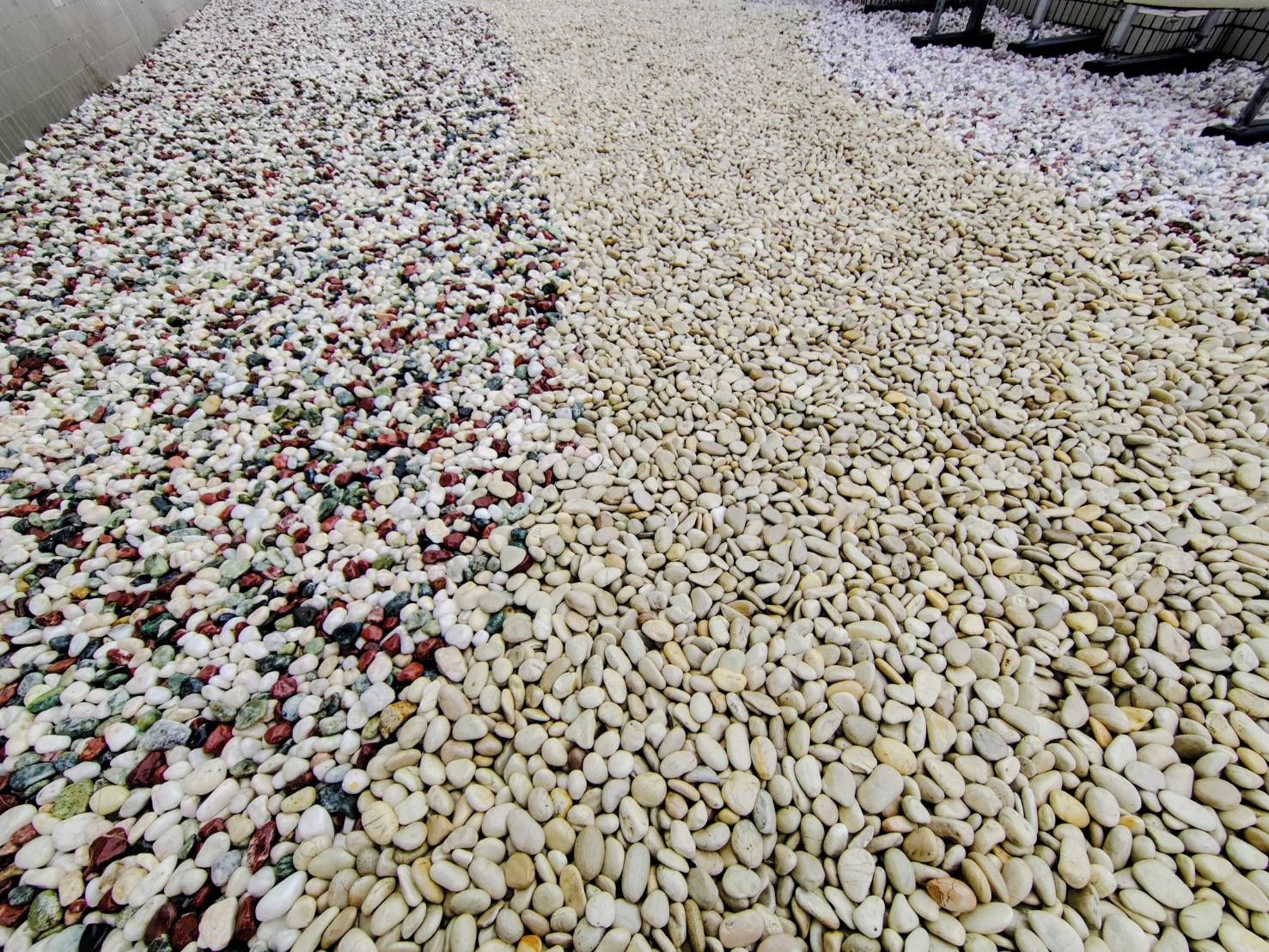 A large indoor space filled with numerous pebbles.