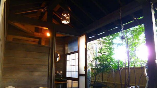 A traditional Japanese room with tatami flooring, a shoji screen door, and a view of greenery outside. - Kirishima Onsen Oyado Hana Mizuki (Kirishima)
