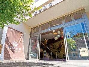 A building with large glass windows and a sign that reads "Resort & Spa".