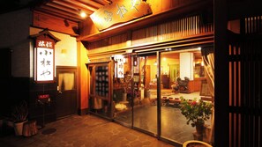 A traditional Japanese restaurant with a wooden exterior and sliding glass doors. - Iizaka Onsen Ryokan Komatsuya (Fukushima)