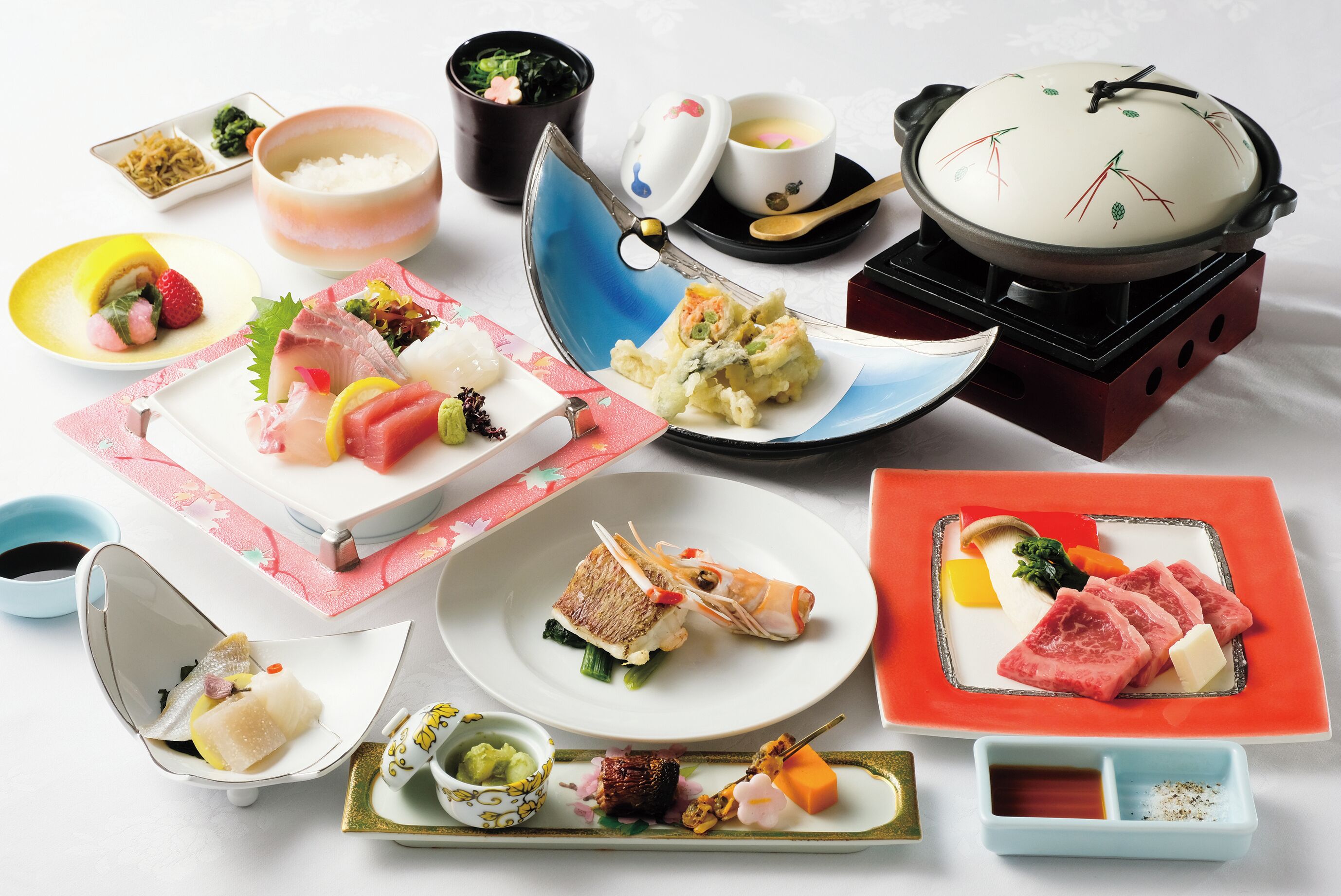 A variety of Japanese dishes arranged on a table.