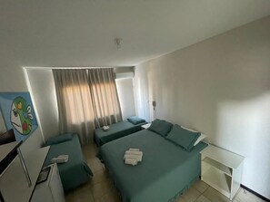 Standard Quadruple Room | Minibar, desk, blackout curtains, iron/ironing board - Hotel Shallom (Balneário Camboriú)