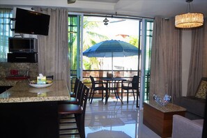 Condo, Non Smoking | Living area | Flat-screen TV, DVD player
