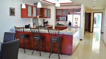 Condo, Non Smoking | Private kitchen | Full-sized fridge, microwave, oven, stovetop