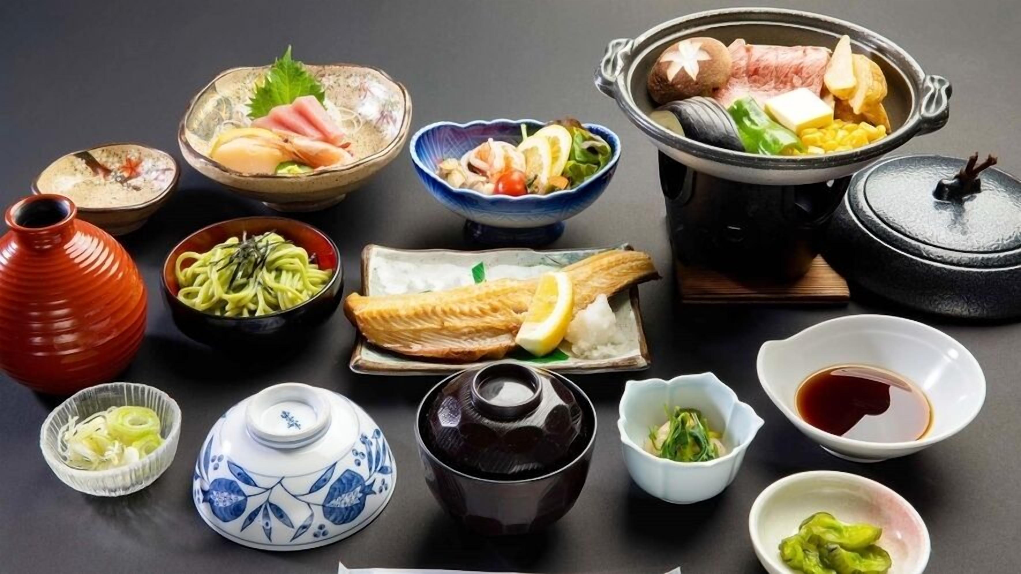 A variety of Japanese dishes and traditional serving ware.