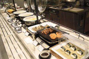 A buffet with various food items, including sushi, and a weighing scale. - Richmond Hotel Nagoya Shinkansenguchi (Nagoya)