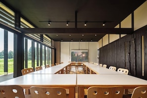 A conference room with a long table and chairs, large windows, and a view of the outdoors. - THE FARM Resort Japan (Katori-shi)