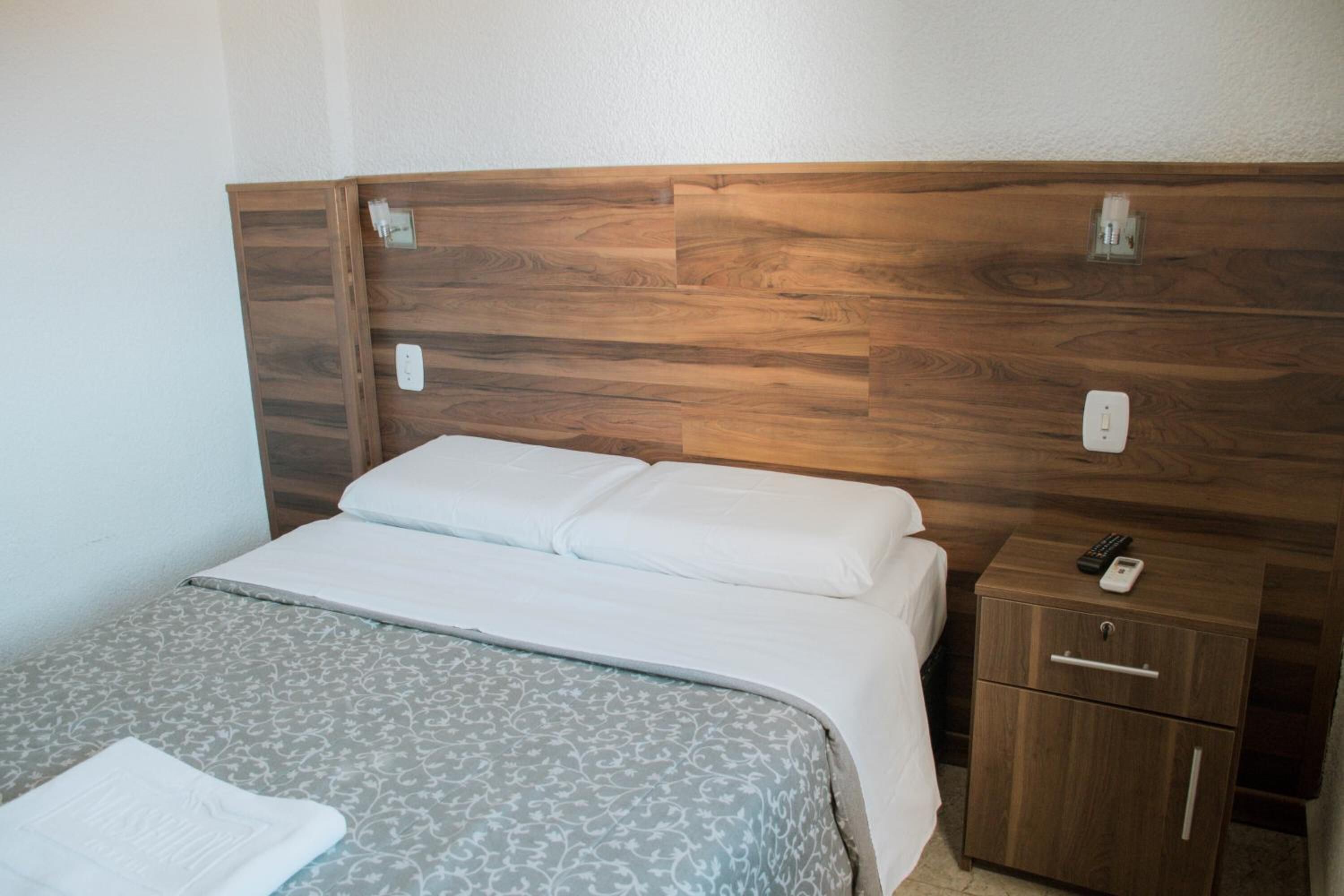 minibar, desk, blackout curtains, iron/ironing board