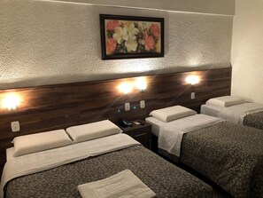 Deluxe Quadruple Room | Minibar, desk, blackout curtains, iron/ironing board - Hotel Masseilot (Santana do Livramento)