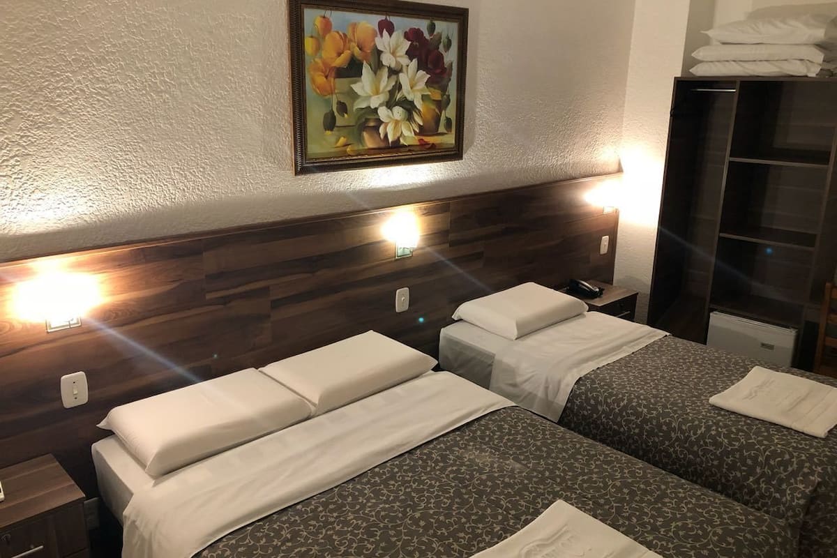 deluxe triple room | minibar, desk, blackout curtains, iron/ironing board