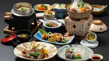 A variety of dishes and traditional Japanese tea sets.
