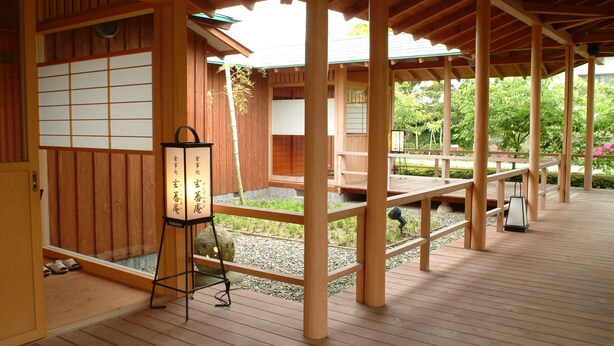 A traditional Japanese-style wooden structure with tatami mat flooring and a lantern. - Seishohtei Shirasuna (Shirako)