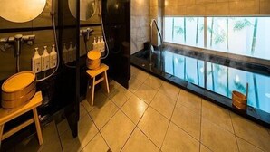 A modern bathroom with a large mirror, two sinks, and a steam shower. - Sekishuu no Yu Super Hotel Gotsu Ekimae (Gotsu)