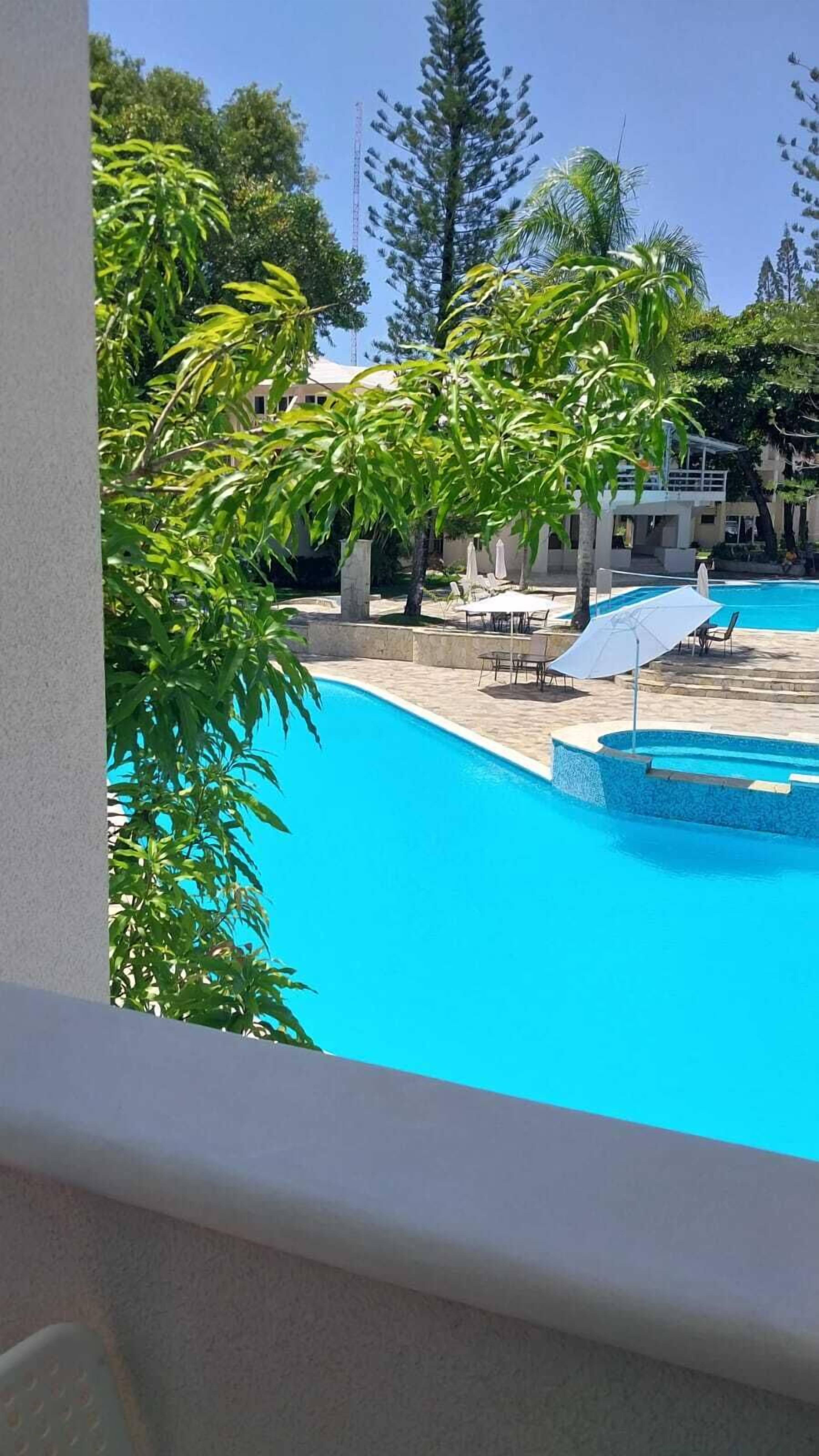 standard double room, 1 king bed, pool view | balcony view