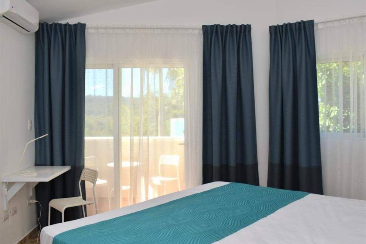 standard double room, 1 king bed, mountain view | hypo-allergenic bedding, in-room safe, soundproofing, iron/ironing board