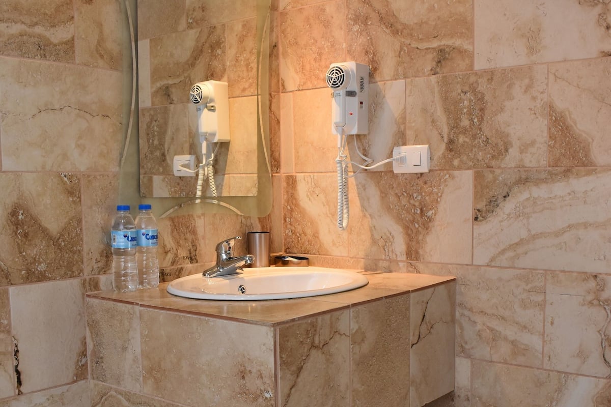 standard double room, 1 king bed, garden view | bathroom | shower, hair dryer, towels, soap