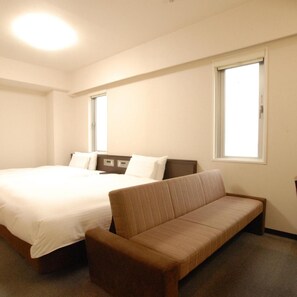 A hotel room with a bed, a sofa, and two windows. - AB Hotel Toyota Motomachi (Toyota)