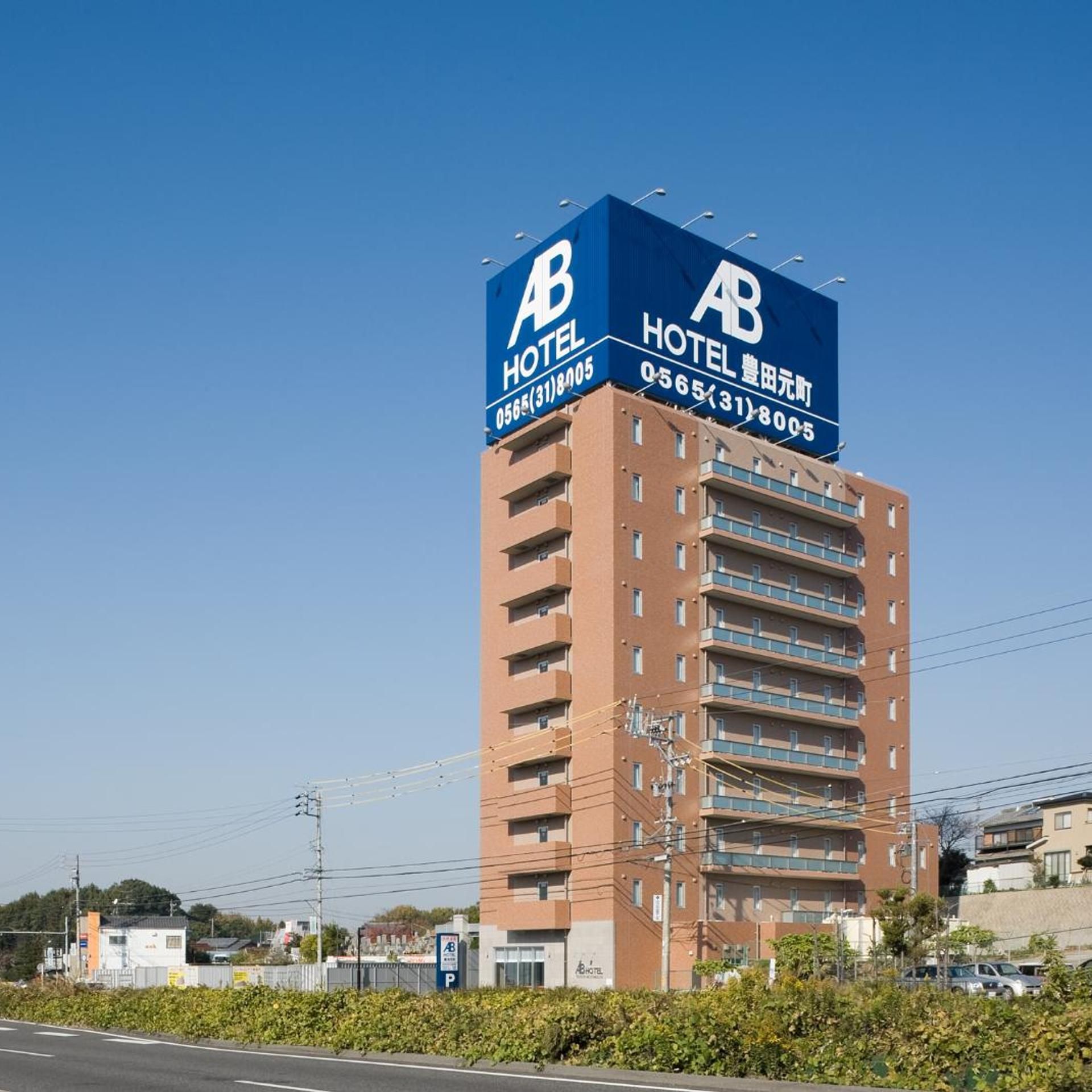 A tall hotel building with a prominent blue sign indicating it is an AB Hotel.