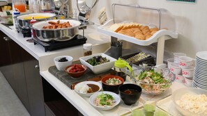 A buffet with various food items and condiments. - Hotel Econo Taki (Taki)