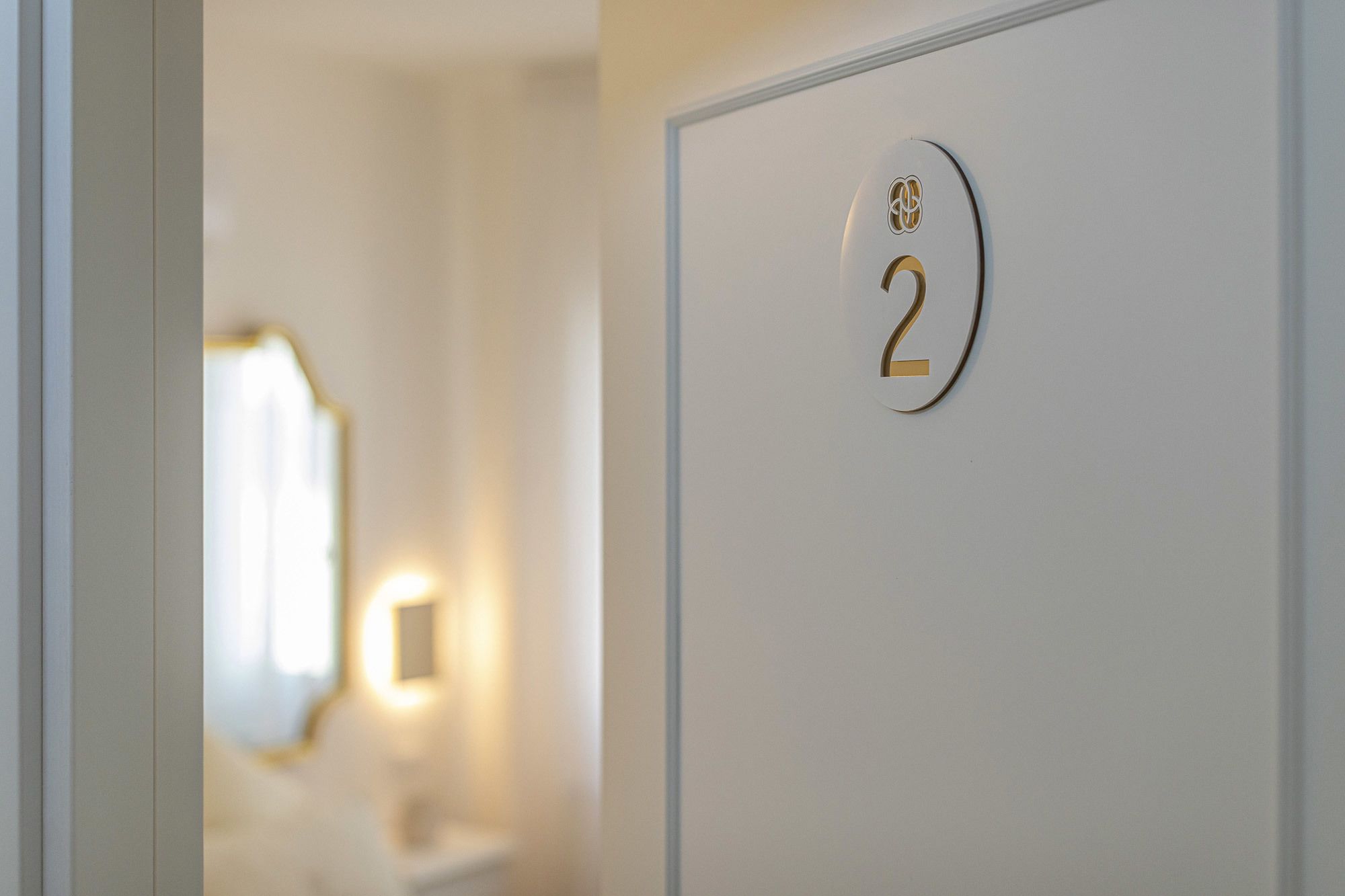 A door with a number plate indicating room 2.