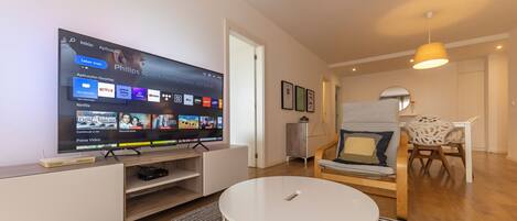 Apartment, 1 Bedroom, City View | Living area | Flat-screen TV