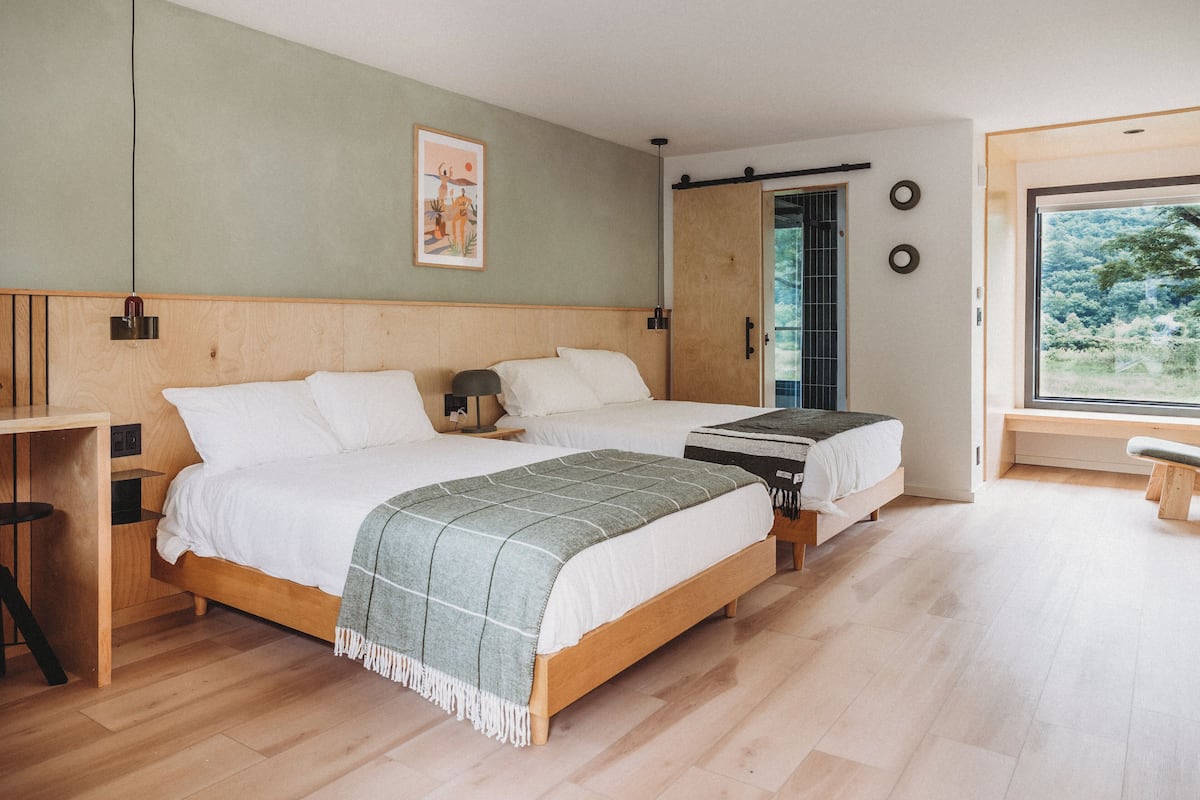 Premium bedding, memory foam beds, desk, laptop workspace