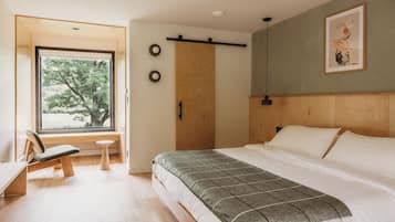 Premium bedding, memory-foam beds, desk, laptop workspace