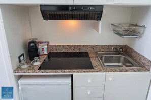 Fridge, stovetop, espresso maker, coffee/tea maker