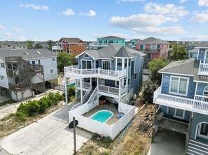 Enjoy a pool and balcony with a two-story house in a residential neighborhood.