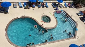 A swimming pool with multiple lanes, lounge chairs, and umbrellas. - Ocean View Unit North Myrtle Beach!  May 5- May 12, 2019 (North Myrtle Beach)