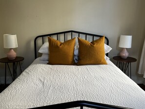 1 bedroom, desk, iron/ironing board, travel crib
