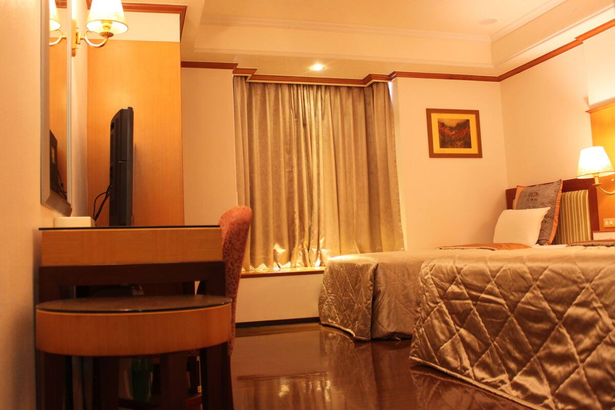 Desk, blackout curtains, soundproofing, rollaway beds