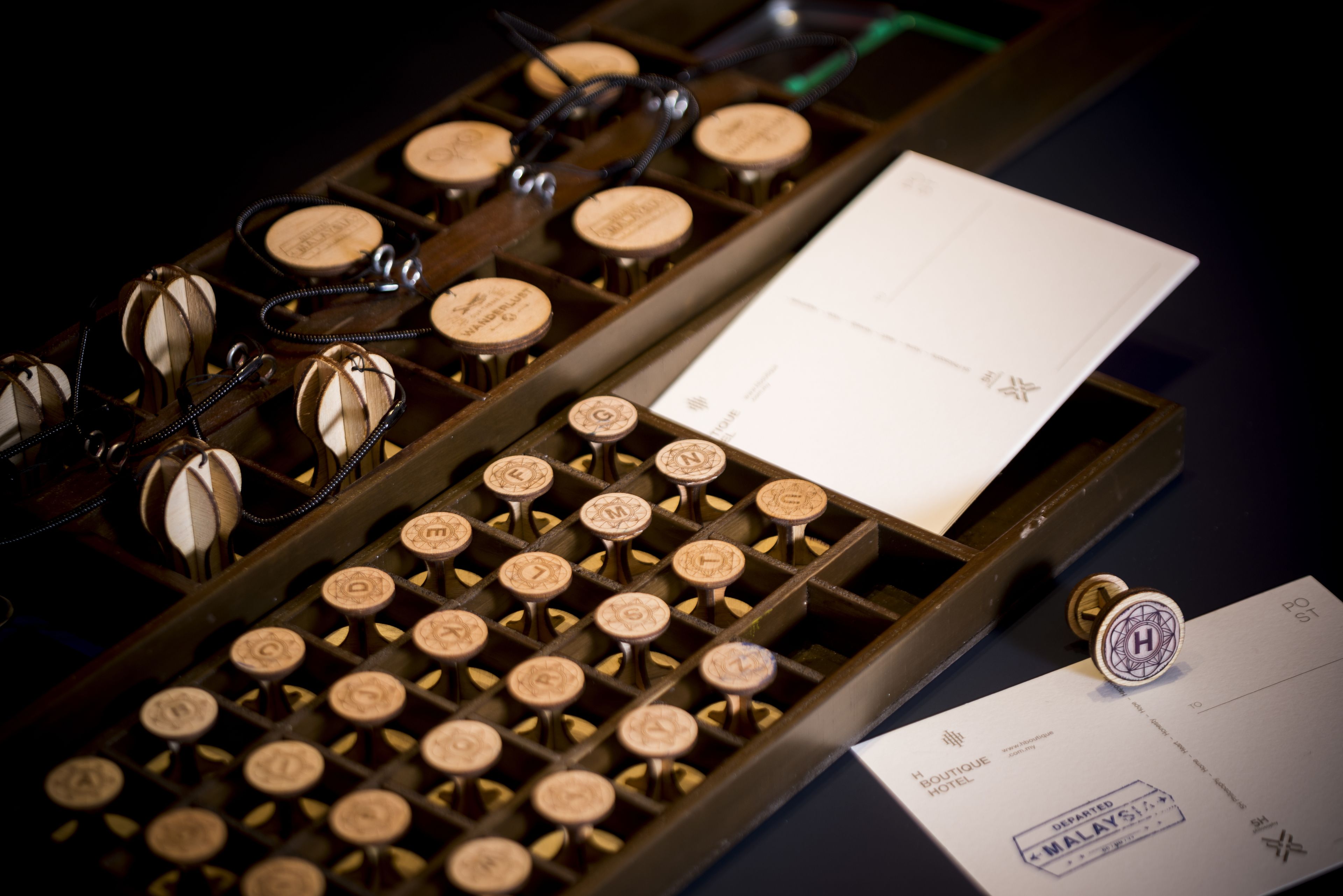 A vintage typewriter with a sheet of paper and a stamp.