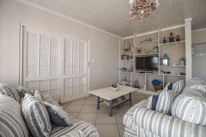 Comfort House, 3 Bedrooms | Living area | Flat-screen TV