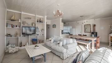 Comfort House, 3 Bedrooms | Living area | Flat-screen TV