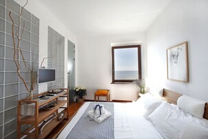 Down comforters, memory foam beds, in-room safe, blackout drapes