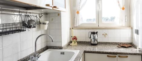 Fridge, oven, dishwasher, dining tables