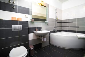 Deluxe Studio, City View | Bathroom | Shower, hydromassage showerhead, designer toiletries, hair dryer